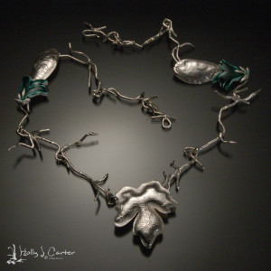 leaf locket necklace by holly j carter, reticulated sterliing silver and fabricated locket, cast sterling silver twig chain, vitreous glass enamel on silver links.